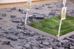 Installation with growing wheat, electric fence and barb wire, 2023